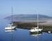 Scene from Porlock Harbour looking out over Porlock Bay on a tranquil evening, Porlock, Somerset, England
