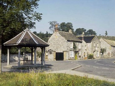 Scene showing the Old Market Stand, Ashford-in-the-Water, Derbyshire Peak District, England