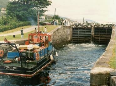 Photograph of a ship waiting to enter a lock on the Caledonian Canal, near Fort William, Scotland