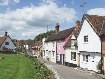 View of colour-washed houses in Churchponds, Castle Hedingham village, Essex
