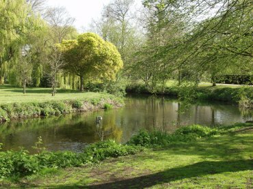 Scene showing the River Colne, Lower Castle Park, Colchester, Essex, England