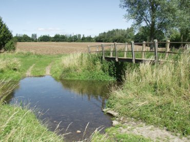 A footbridge over the River Brain near the John Ray path, White Notley, Braintree, Essex, England