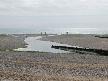 The Cuckmere River flowing into the sea, Sussex, England