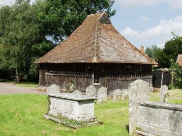 Photograph of the 16th Century Bell Cage, the church of St. Mary the Virgin, Eastbergholt, Suffolk, England