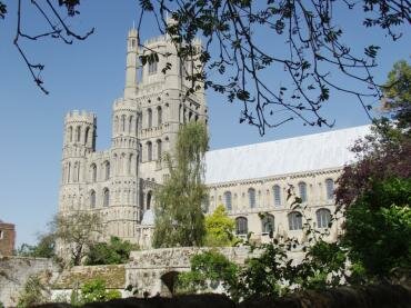 Scene showing the West Tower of Ely Cathedral from across the Bishop's garden, Ely, Cambridgeshire, England