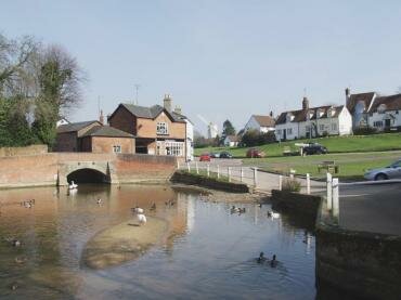 View of the village pond and the windmill, Finchingfield, Essex, England