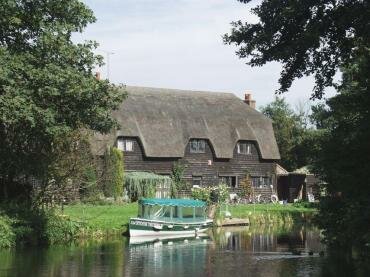 Photograph of the Granary Barn across the River Stour, Flatford Mill, Dedham Vale, Suffolk, England