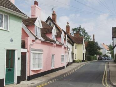 Photograph of Castle Street with some pretty colour-washed houses, Framlingham, Suffolk, England