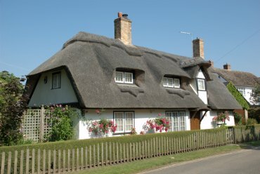 Scene showing a thatched cottage, Houghton, Huntingdonshire (Cambridgeshire), England