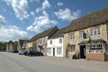 Scene showing High Street, Lacock, Wiltshire (Wilts), England