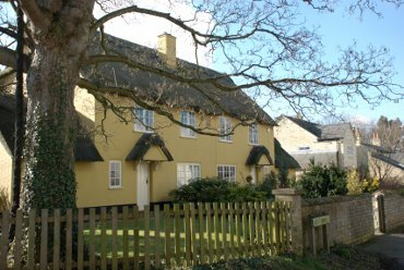 Photograph of thatched semi-detached houses, Lode, Cambridgeshire, England