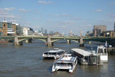 View east along the Thames from the Millenium Bridge, London, England
