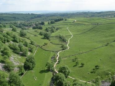 View from the top of Malham Cove looking south towards Malham, Yorkshire Dales, North Yorkshire, England