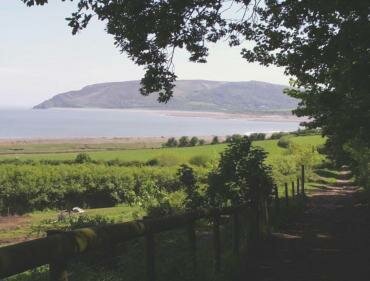 View of Porlock Bay from the path to Culbone Church showing Bossington Hill, Somerset, England
