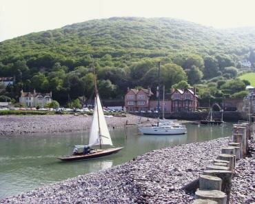 View of Porlock Weir harbour entrance at low tide, Porlock, Somerset, England