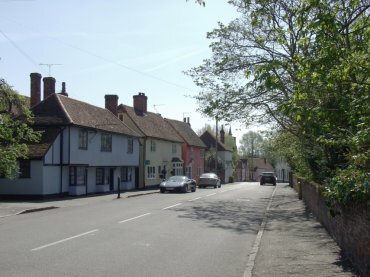 View of colour-washed houses, High Street, Stebbing, Essex, England