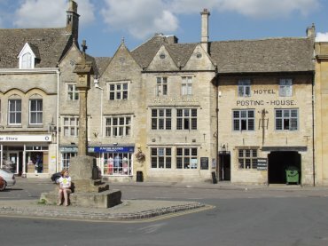 View of the Market Cross and the Kings Arms, Stow-on-the-Wold, Gloucestershire, England