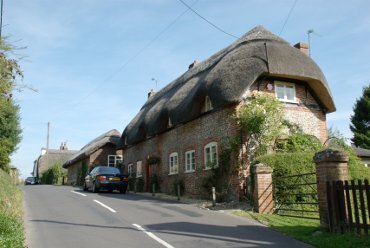 Photograph of a flint and brick thatched house, Andover, Hampshire (Hants), England