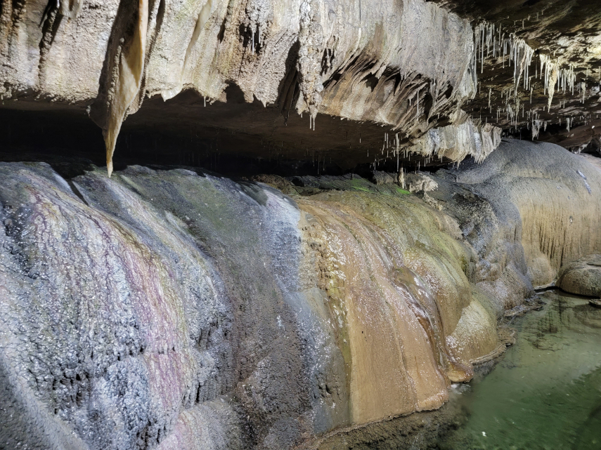Coloured calcite, Main Stream Passage, Ingleborough Cave, Clapham, Yorkshire, England, Great Britain