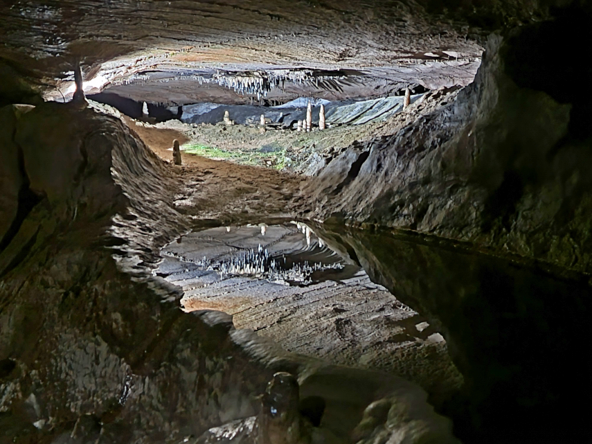 Small pool with reflections, Main Stream Passage, Ingleborough Cave, Clapham, Yorkshire, England, Great Britain