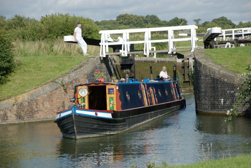 Picture of a narrowboat emerging from a lock, Caen Hill Locks, Rowde, Devizes, Wiltshire, England