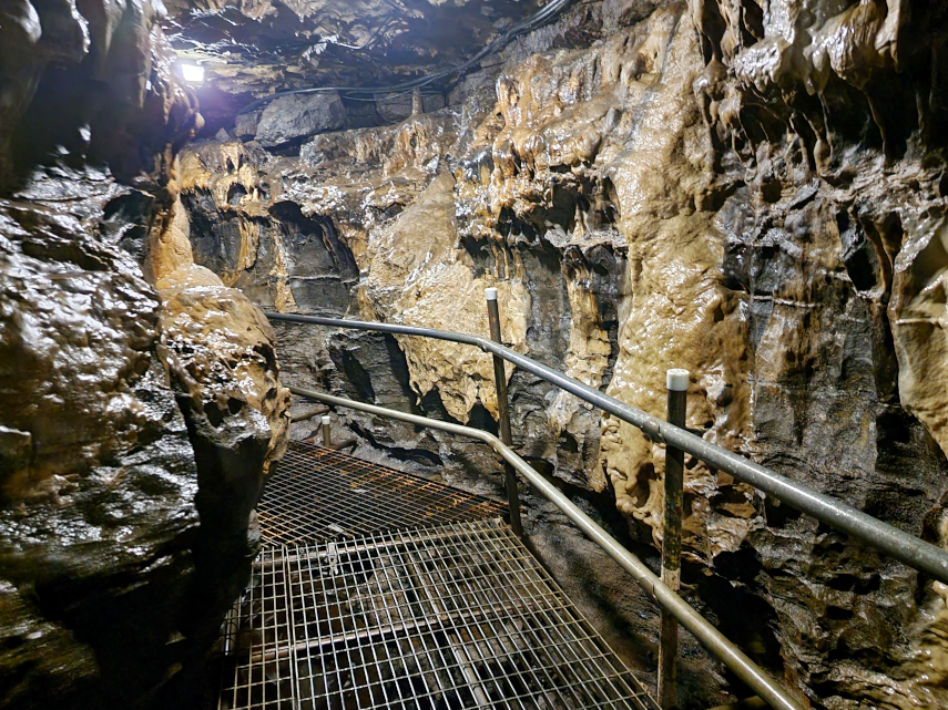 A section of the main stream passage showing calcite flows, White Scar Cave, Ingleton, Yorkshire, England, Great Britain