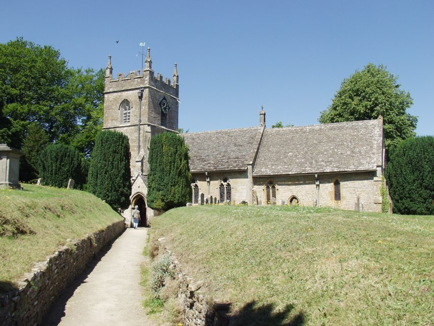 Scene showing the church of St. Peter, Upper Slaughter, Gloucestershire, England