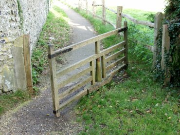 View of the swiveling gate, Jevington Churchyard, Sussex, England