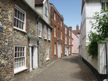 View of a cobbled lane in the cathedral close, Norwich, Norfolk, England